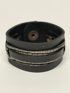 Brazalete Mangel Delferri negro y plateado con franja lineal – Courage Bracelet